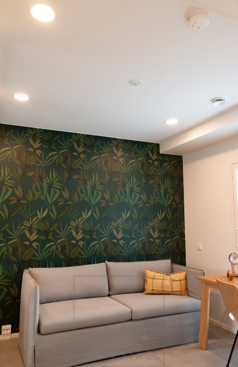In the living room, round led panels illuminate the space. Ledstore.fi